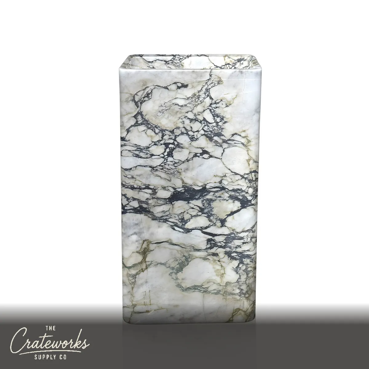 Solid stone pedestal sink, carved in one piece