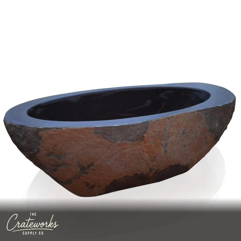 granite bathtub with brown rustic surface, perfect for outdoor bathing experiences