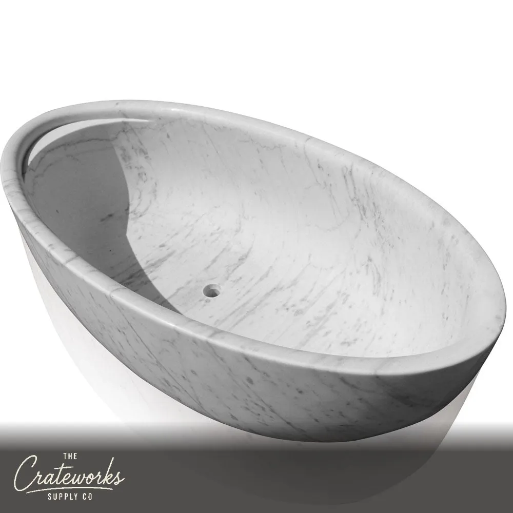 White marble bathtub with headrest and wine glass holder for the ultimate bathing experience