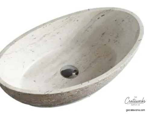 Carved stone basin set into a vanity top